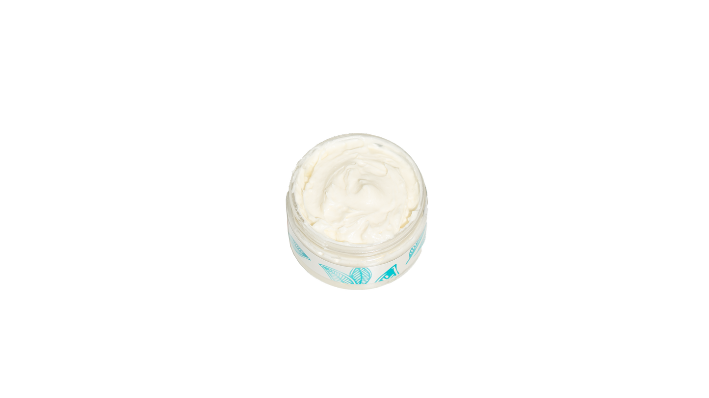 A 4 oz. jar of body butter with its lid off is displayed against a white background, showcasing the creamy texture of the body butter from an overhead view, emphasizing its rich and smooth quality.